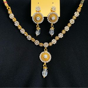 Golden necklace. Set of necklace, earrings, maangtika Rhinestones and beads work